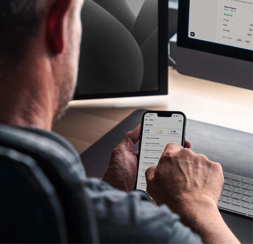 photo of a person using the MileIQ app on their phone